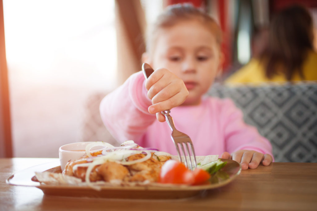 Child eating fried chicken