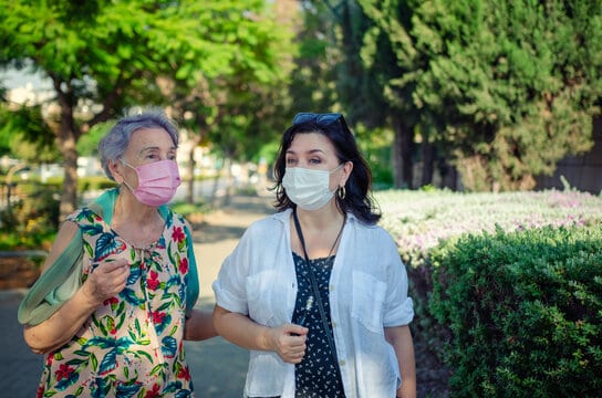 caregiver walking with face mask