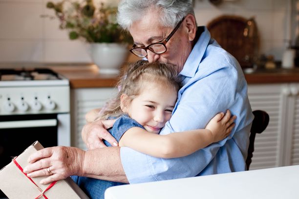 kid giving gifts for seniors